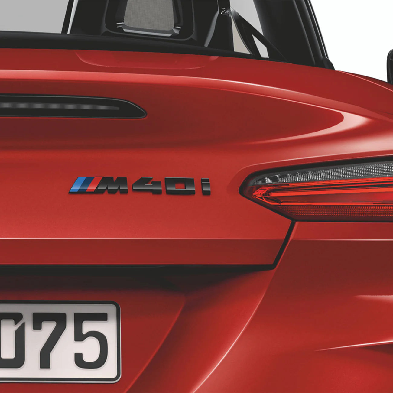 Gloss black rear badge with the letters M40i, designed for a BMW vehicle. Badge on a Z4.