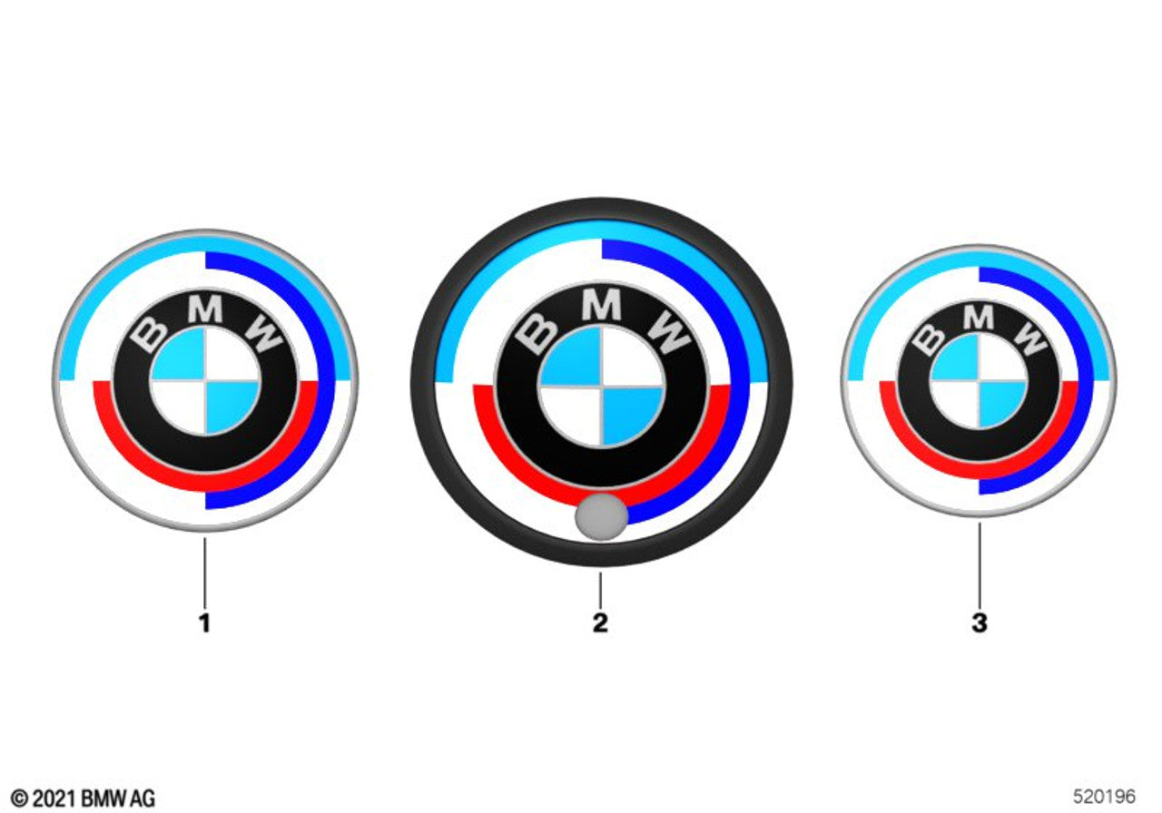 A Genuine BMW 50th Anniversary Heritage Badge Emblem featuring black, blue, red, and white colours with the BMW logo.