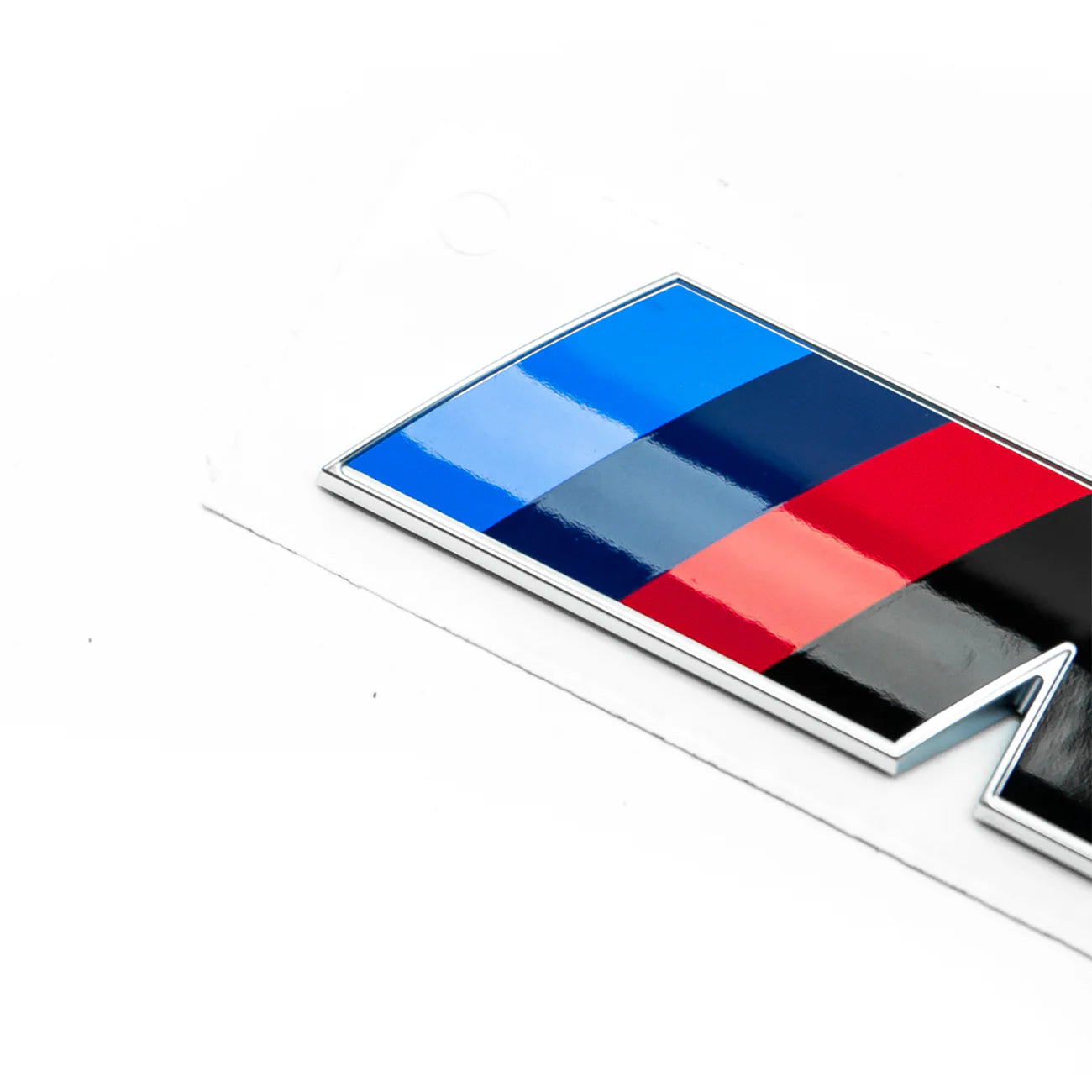 Close Up - Gloss black rear model badge for BMW F90 M5 LCI with silver edging