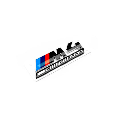 Gloss black rear model badge for BMW M4 Competition, featuring silver edging and the M4 Competition logo. Genuine BMW